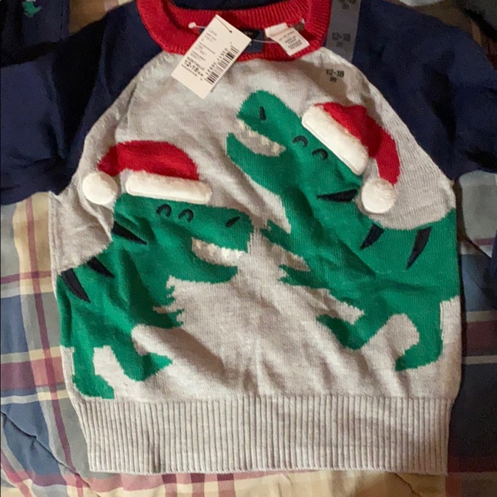 A baby boy Christmas sweater